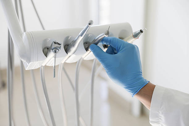 Professional Emergency Dentist technician working in Village of Four Seasons, MO